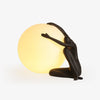 Humanoid Ball Holding Table Lamp - Vakkerlight