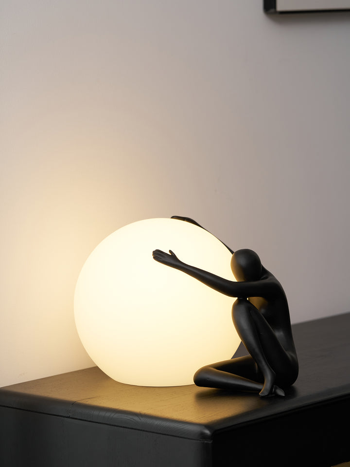 Humanoid Ball Holding Table Lamp