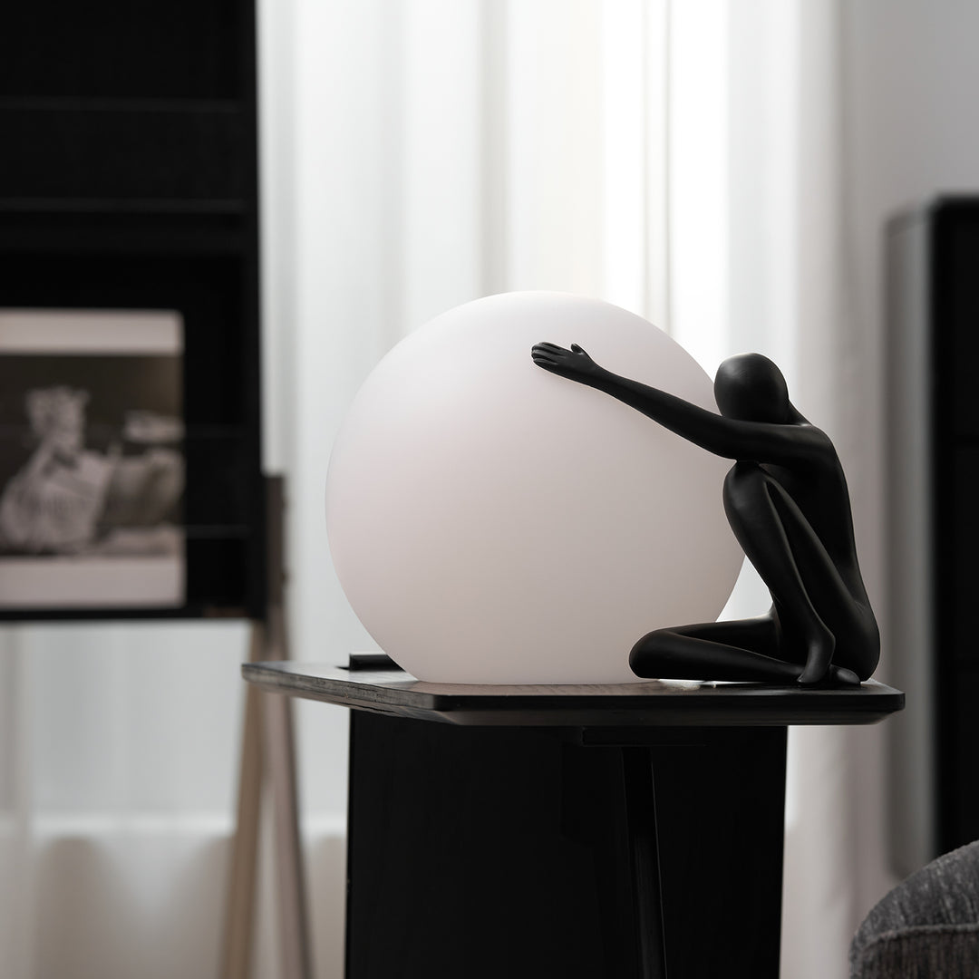 Humanoid Ball Holding Table Lamp