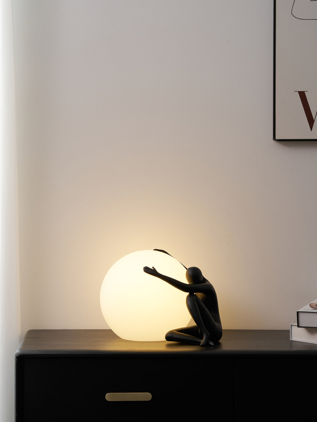 Humanoid Ball Holding Table Lamp