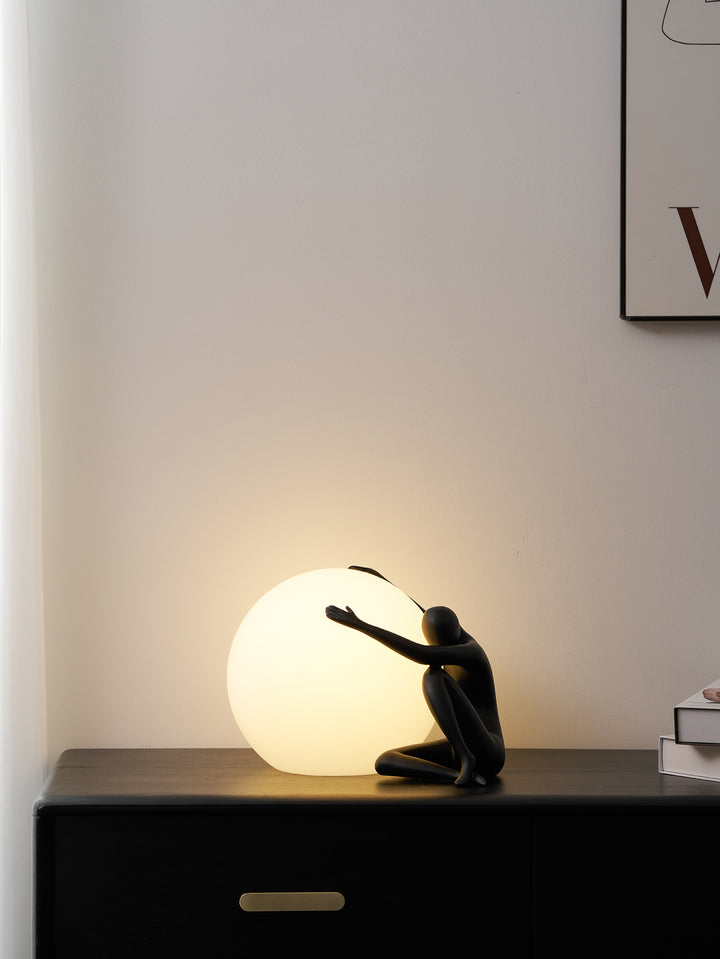 Humanoid Ball Holding Table Lamp