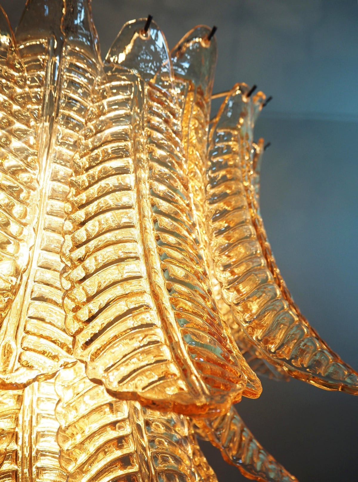 Glass chandelier soft warm light diffusion
